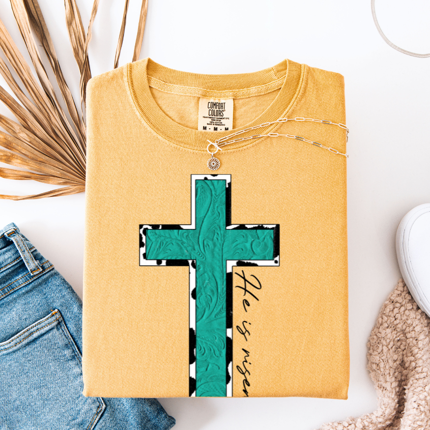 Turquoise & Cow Print He is Risen Cross Graphic Tee
